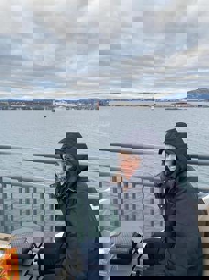 Nicole sitting next to the water